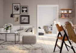 A well furnished apartment with a gray, simplistic style that emphasizes what matters in the room